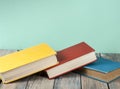 Stack of colorful books on wooden desk, free copy space. Back to school. Education background Royalty Free Stock Photo