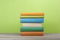 Stack of colorful books on the wooden table. Education background. Back to school. Copy space for text. Royalty Free Stock Photo