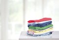 Stack of colorful clothes on table empty copy space,cotton clothing pile Royalty Free Stock Photo