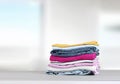 Stack of colorful clothing,cotton folded clothes stacked.Apparel on table empty copy space Royalty Free Stock Photo