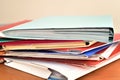 Stack of document file folders on the brown wooden desk Royalty Free Stock Photo