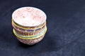 Stack of colorful empty ceramic bowls closeup on black board background Royalty Free Stock Photo