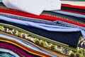 Stack of colorful fabrics showing various patterns and textures Royalty Free Stock Photo