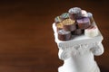 Stack of Fine Artisan Chocolates Stacked On White Pillar Column Royalty Free Stock Photo