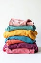 Stack of colorful folded clothes on white background. Laundry concept Royalty Free Stock Photo