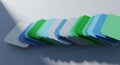 Stack of Colorful Folders Arranged in a Gradient on a Blue Surface Royalty Free Stock Photo