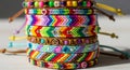 A stack of colorful friendship bracelets featuring intricate patterns and designs. The Royalty Free Stock Photo