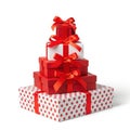 Stack of colorful gift boxes with red bows isolated on white background Royalty Free Stock Photo
