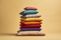 A stack of colorful, isolated pillows. Cushions in bright and varied colors. Royalty Free Stock Photo