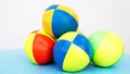 Stack of colorful juggling balls on blue table