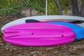 A Stack Of Colorful Kayaks Left Outdoors Royalty Free Stock Photo