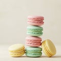 Stack of colorful macarons against a plain background. Five macarons are shown, Royalty Free Stock Photo
