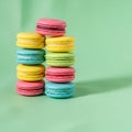 Of three columns of macarons featuring vibrant hues of pink yellow Royalty Free Stock Photo