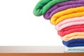 Stack of colorful microfiber towels toppling