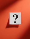 Paper notes with question marks on Coral background, flat lay. Space for text Royalty Free Stock Photo