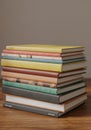 Stack of Colorful Notebooks on Wooden Table Royalty Free Stock Photo