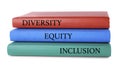 Stack of colorful notebooks with words Diversity, Equity, Inclusion on white background