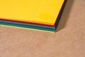 Stack of colorful paper. Blurring background. The corners of sheets of paper close-up. Back to school. Bright natural background