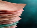 Stack of colorful paper sheets on a dark background. Royalty Free Stock Photo