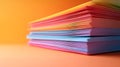 Stack of colorful paper sheets on orange background, artistic concept Royalty Free Stock Photo