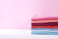 Composition with folded clothes, unisex for both man and woman, different color & material. Pile of laundry, dry clean clothing Royalty Free Stock Photo