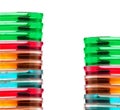 Stack of colorful Petri dishes isolated