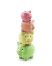 Stack of colorful piggy banks. Energy saving concept. Royalty Free Stock Photo