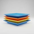 A stack of colorful plastic plates in blue, orange, and yellow arranged on a white background Royalty Free Stock Photo