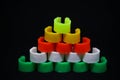 Stack of colorful plastic rings for pigeons on a dark background Royalty Free Stock Photo