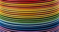 Stack of Colorful Plates Arranged in a Rainbow Gradient Royalty Free Stock Photo