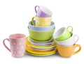 Stack of colorful plates and cups isolated on white background Royalty Free Stock Photo