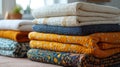 Stack of colorful quilts in a cozy room setting Royalty Free Stock Photo