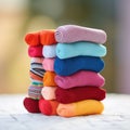 A stack of colorful socks on a white table, AI