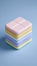 Stack of Colorful Square Objects on Blue Background Royalty Free Stock Photo