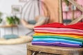 Stack of colorful t-shirts on chair