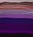 Stack of colorful t-shirts. Layers of colorful fabric. Stack of colorful folded clothes, multicolored background