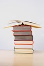 A stack of colorful thick books on a table Royalty Free Stock Photo