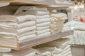 Stack of colorful towels in the department store. Many pile of cotton towels in store shop. Concept of shopping, buy and sell