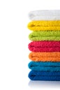 Stack of colorful towels isolated on white background Royalty Free Stock Photo