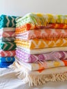 Stack of colorful woven blankets with fringe edges. Royalty Free Stock Photo