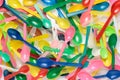 Stack of colourful plastic spoons. Royalty Free Stock Photo