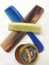 Stack of Combs and Pomades on a White background Royalty Free Stock Photo