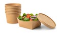 Stack of compostable containers with fresh salad and lid Royalty Free Stock Photo