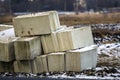 Stack of concrete blocks for foundation on construction site. Ferroconcrete reinforced with metal blocks Royalty Free Stock Photo