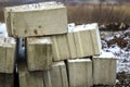 Stack of concrete blocks for foundation on construction site. Ferroconcrete reinforced with metal blocks Royalty Free Stock Photo