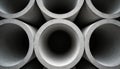 Stack of concrete pipes arranged symmetrically. Construction material, architecture. Round structures form pattern, creating Royalty Free Stock Photo