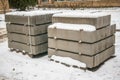 Stack of concrete road curbs in a yard for the overhaul of a sidewalk, organised by municipal public utility service. Royalty Free Stock Photo