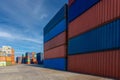 Stack of containers in a harbor. Shipping containers stacked on cargo ship. Background of Stack of Containers at a Port. Royalty Free Stock Photo