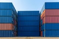 Stack of containers in a harbor. Shipping containers stacked on cargo ship. Background of Stack of Containers at a Port. Royalty Free Stock Photo