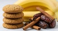 Stack of Cookies with Bananas, Dates, and Cinnamon Sticks Royalty Free Stock Photo
